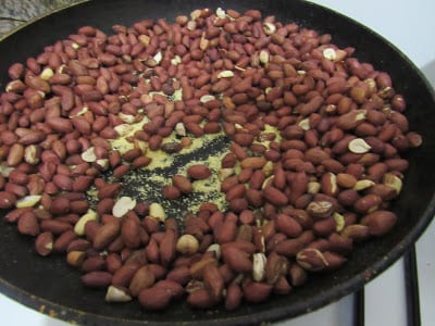 Roasting groundnuts with Nigerian garri